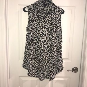 Black and white leopard print high low blouse.